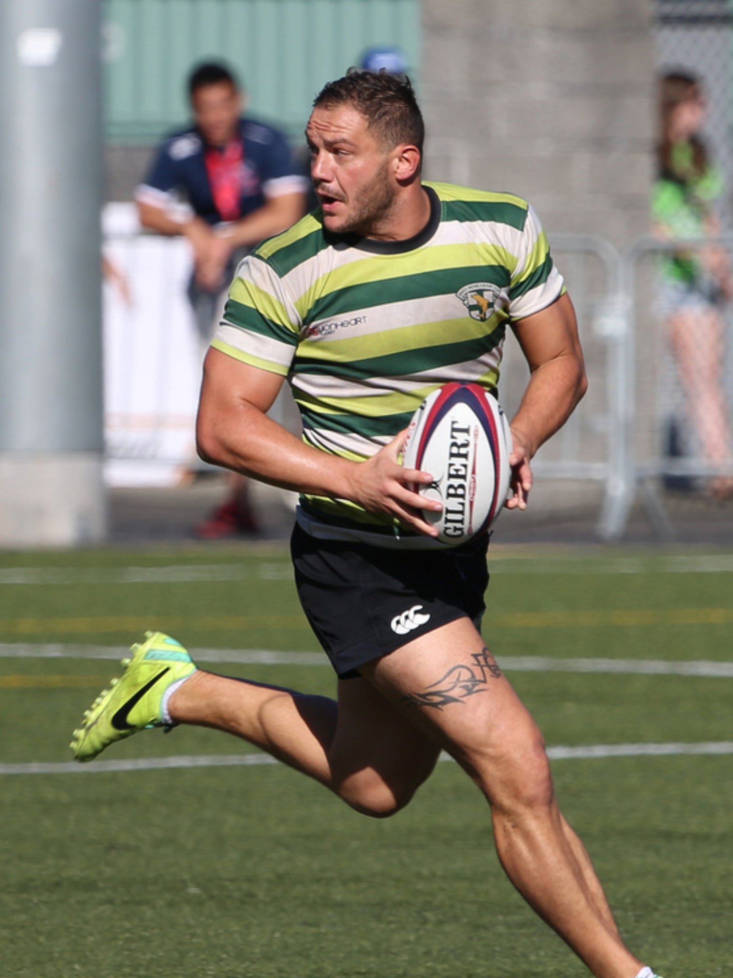 Mathieu Lesgourgues playing professional rugby with ball on field