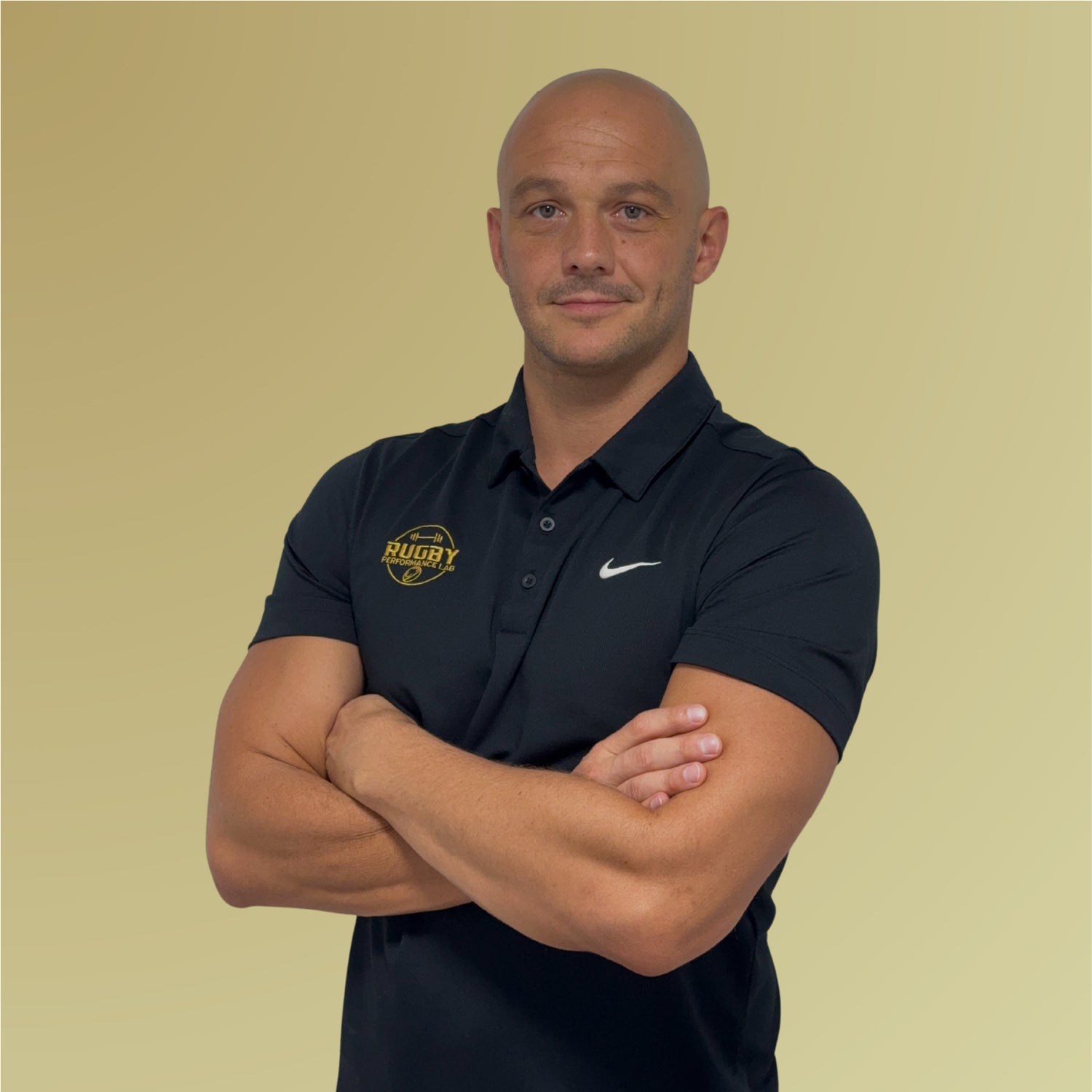 Mathieu Lesgourgues, Peak founder and professional rugby player, wearing PEAK black shirt on gold background
